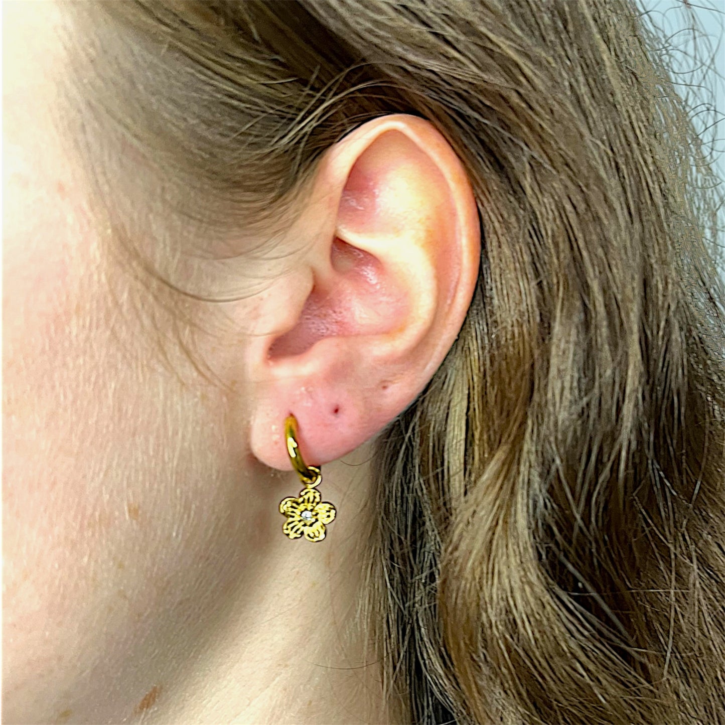 Stainless Steel flower earrings gold-plated. Durable and waterproof jewelry for any occasion.