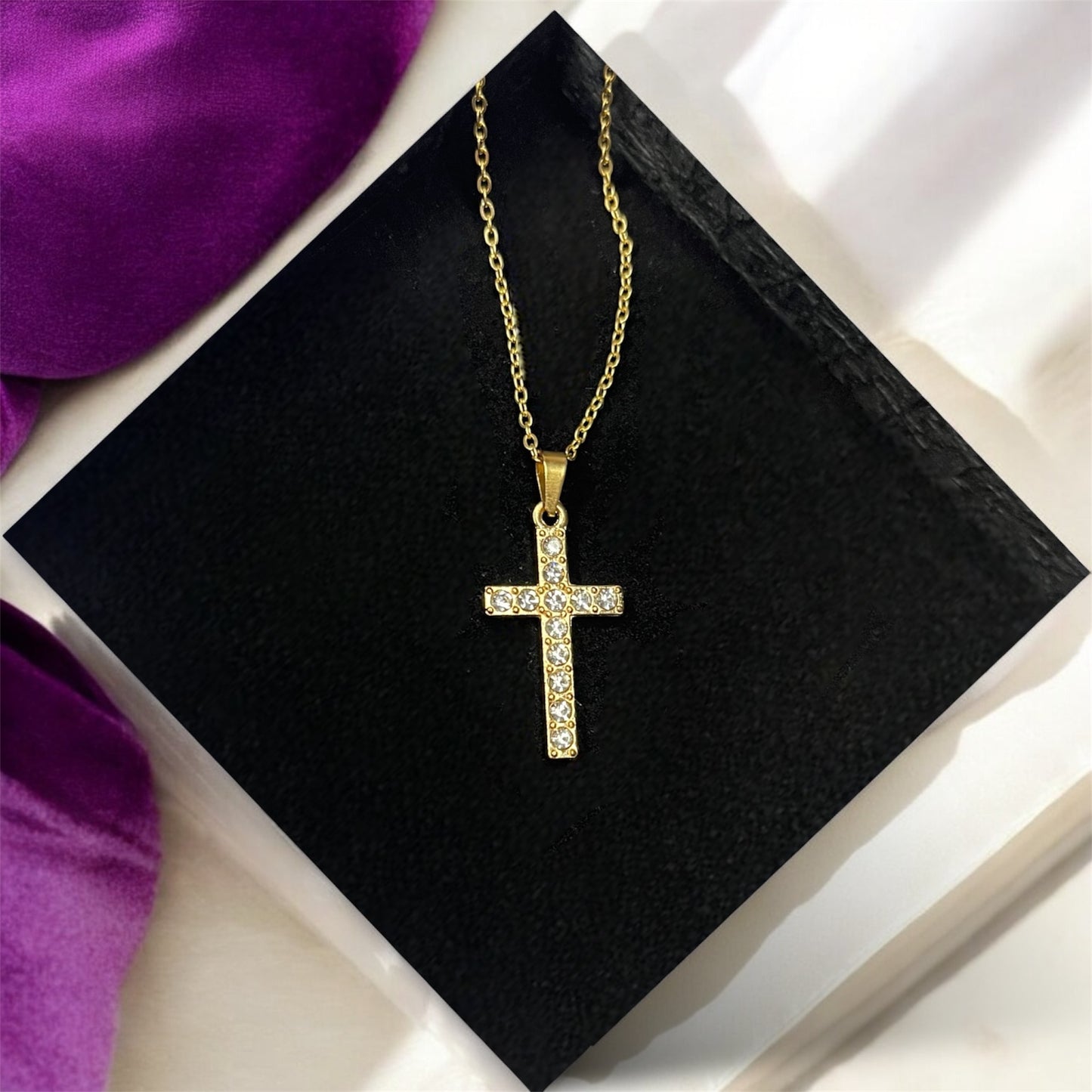 High-quality gold-plated stainless steel necklace with a cross pendant, designed with sparkling crystals. Wear it to show in what you believe.