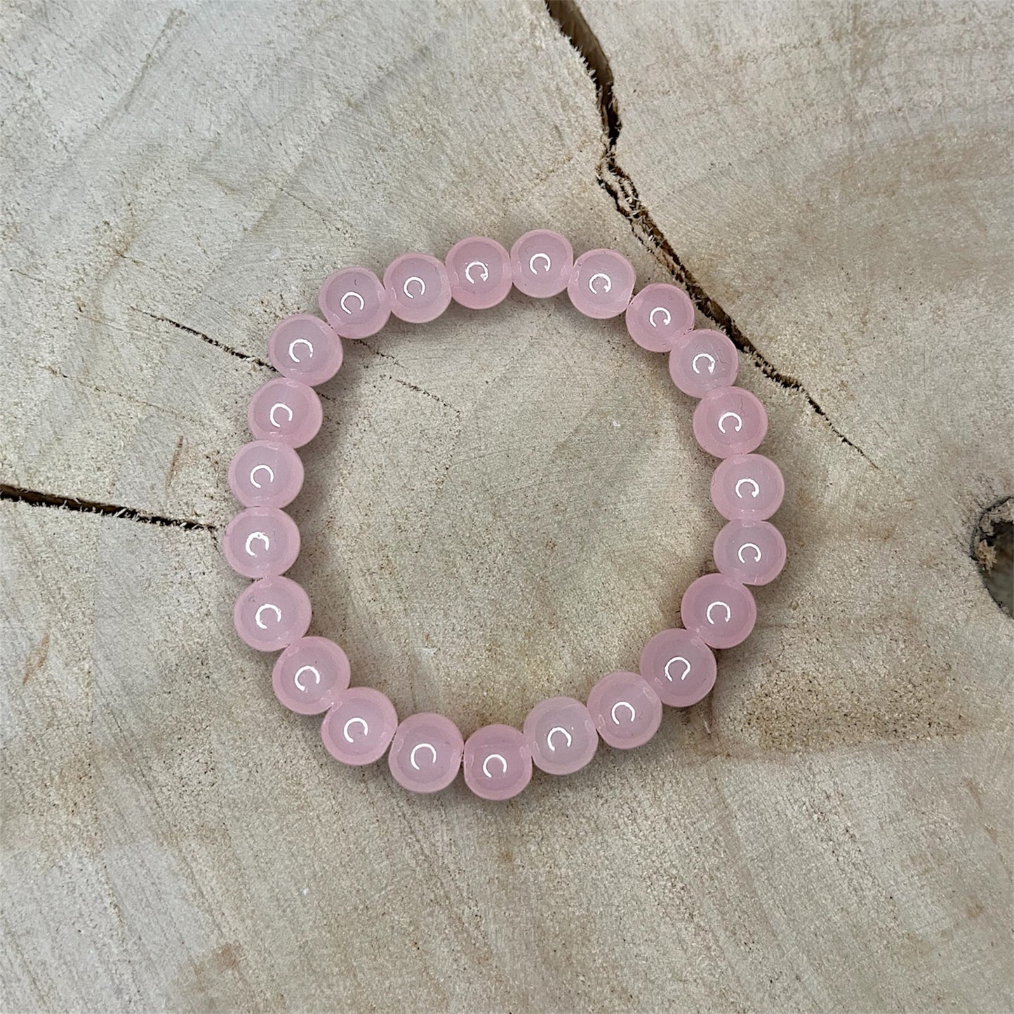 Waterproof bracelet made of pink gemstone beads, stylish accessory for everyday wear and leisure, durable water-resistant and nice to wear.