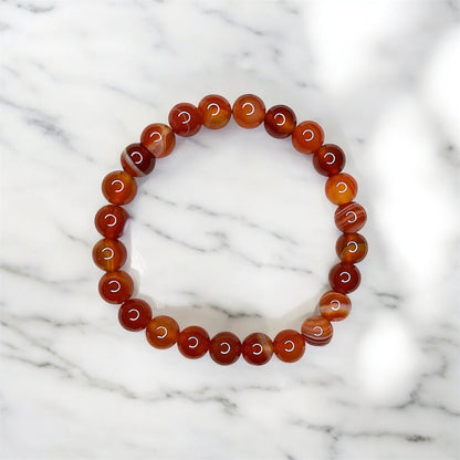 Waterproof gemstone bracelet with red beads, stylish, durable and perfect for every day.