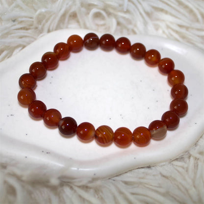 Gemstone bracelet in red perfect for your holiday. Waterproof and stylish.