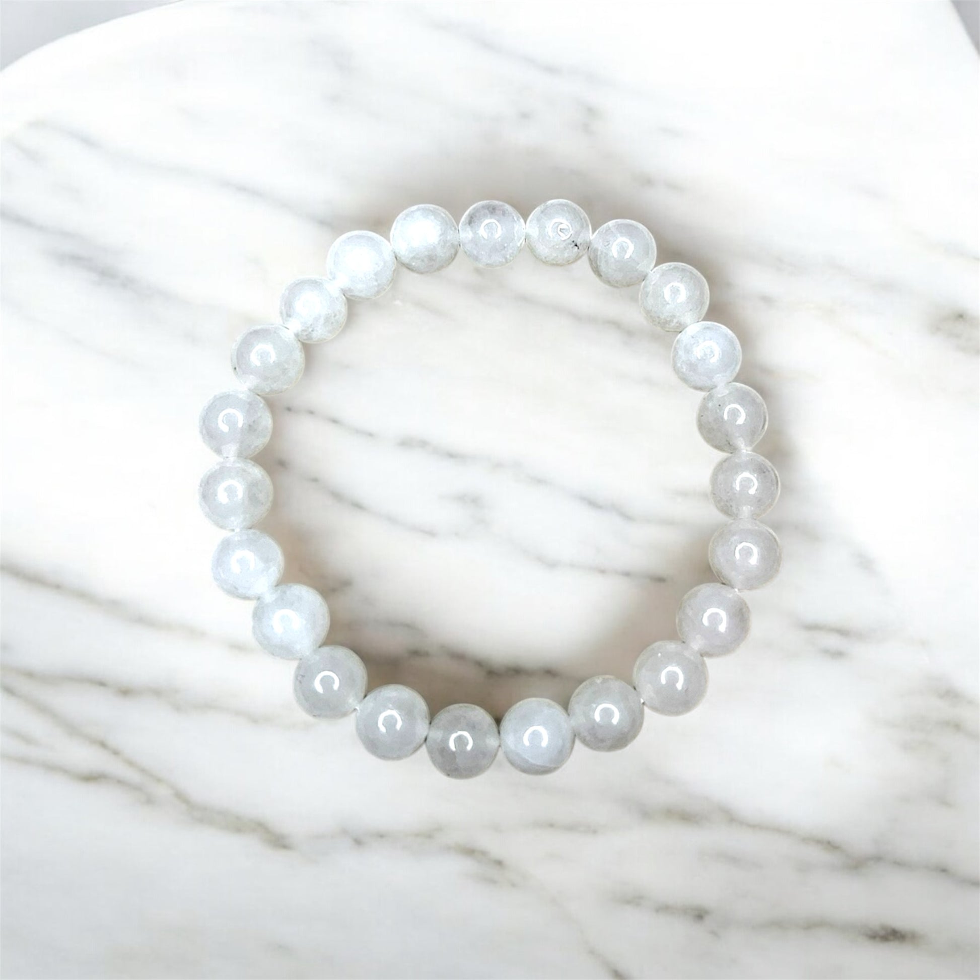 Waterproof gemstone bracelet with white beads, stylish, durable and perfect for every day.